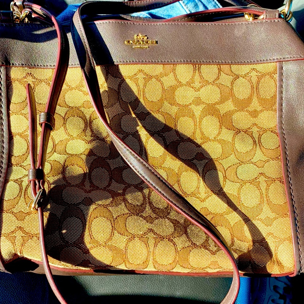 Very lightly used with tissue wrap still on interior zippers